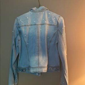 Brand new denim jacket with beautiful curls faceted to it Brand new with tags